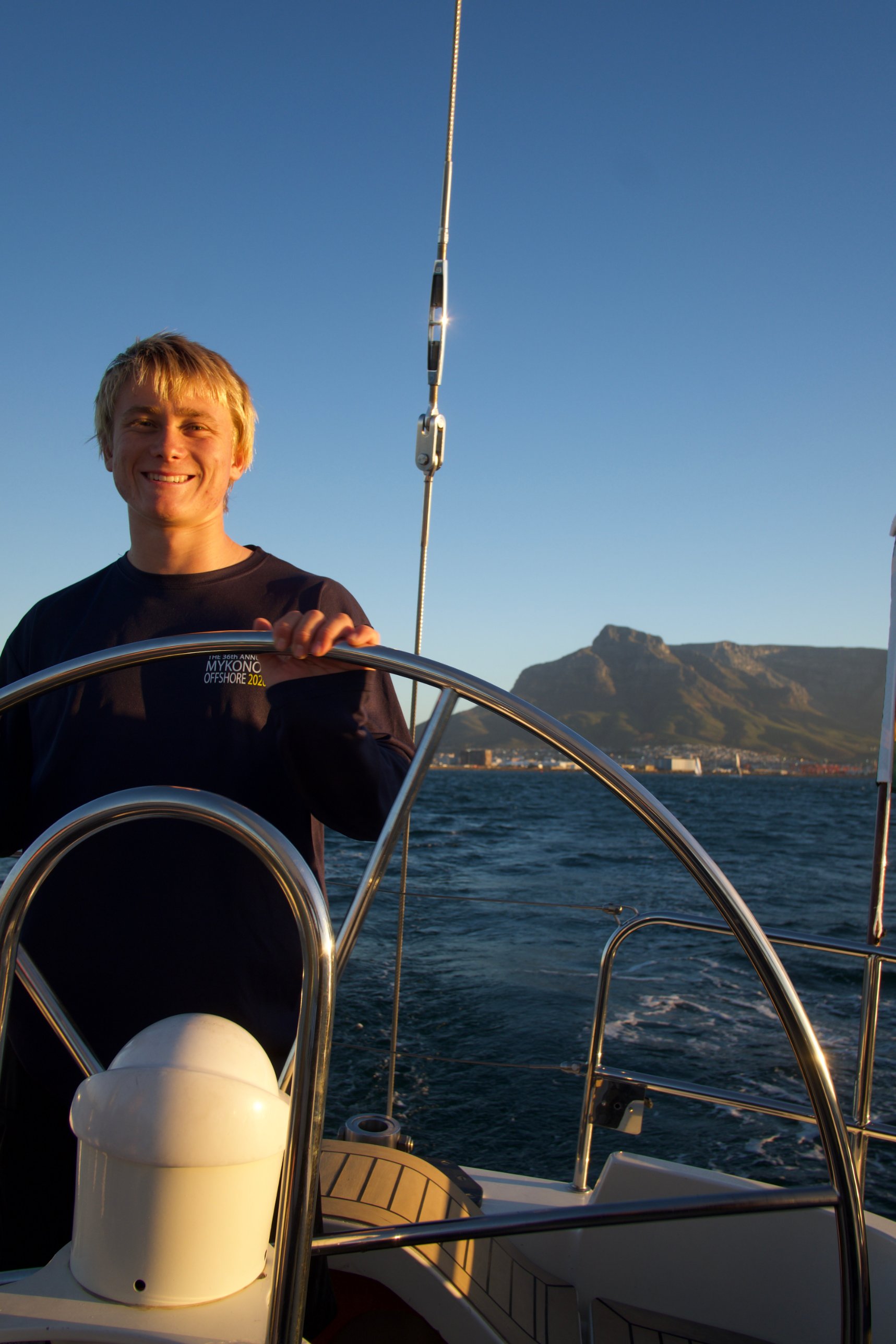 Theo Scheder-Bieschin at the helm with Table Mountain behind